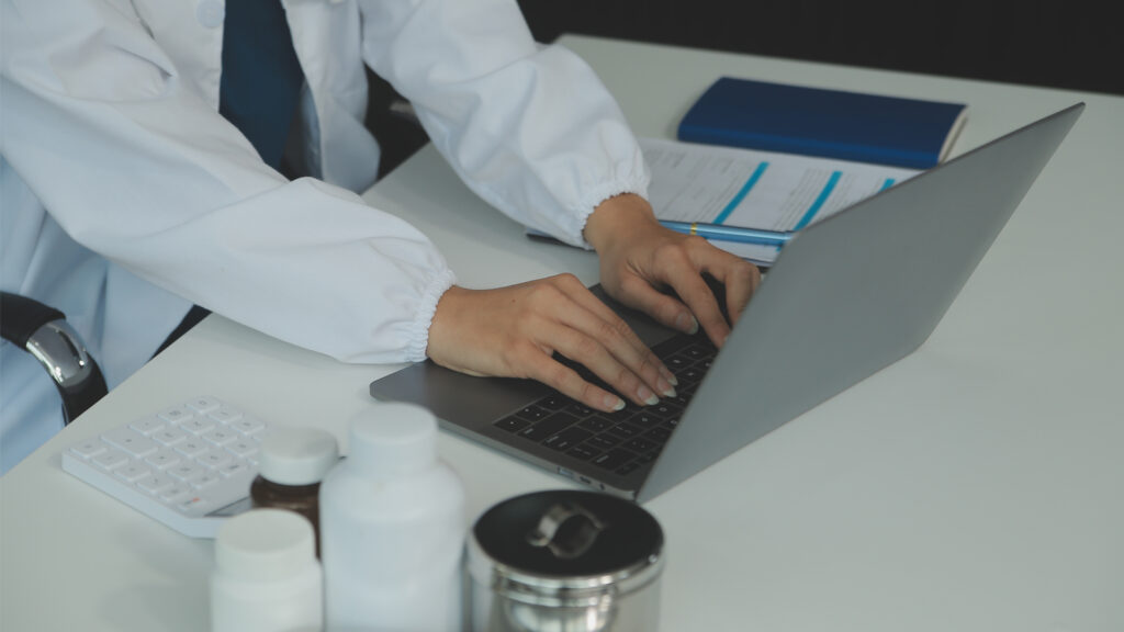 medical biller professional working on the computer